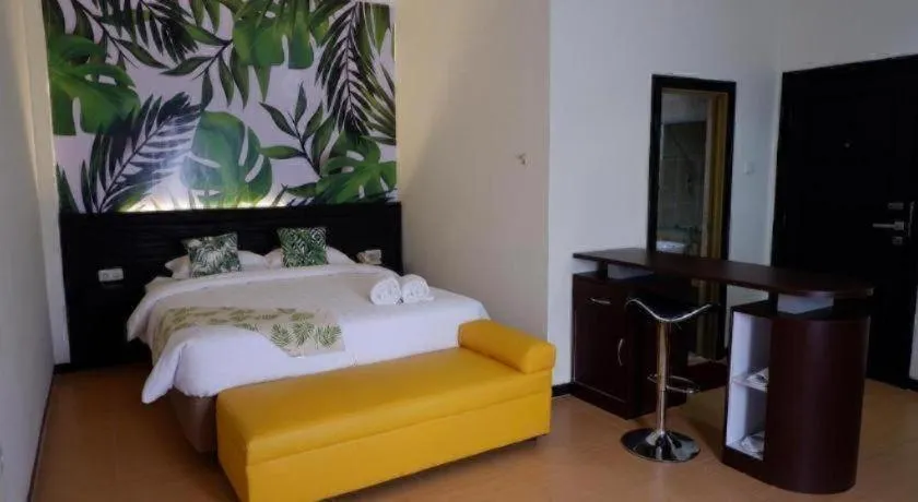 Bed in Tropical Point Hotel Syariah