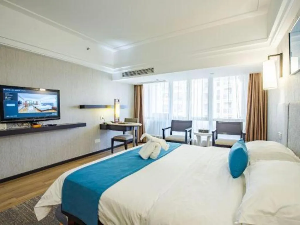 Bed in Ramada Encore by Wyndham Qionghai Downtown
