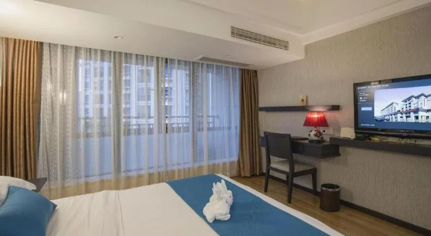 Bed in Ramada Encore by Wyndham Qionghai Downtown