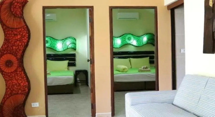 Bed in Kamala Tropical Garden Hotel