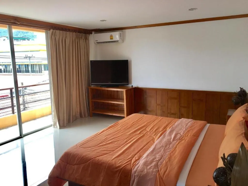 Bed in Kamala Tropical Garden Hotel