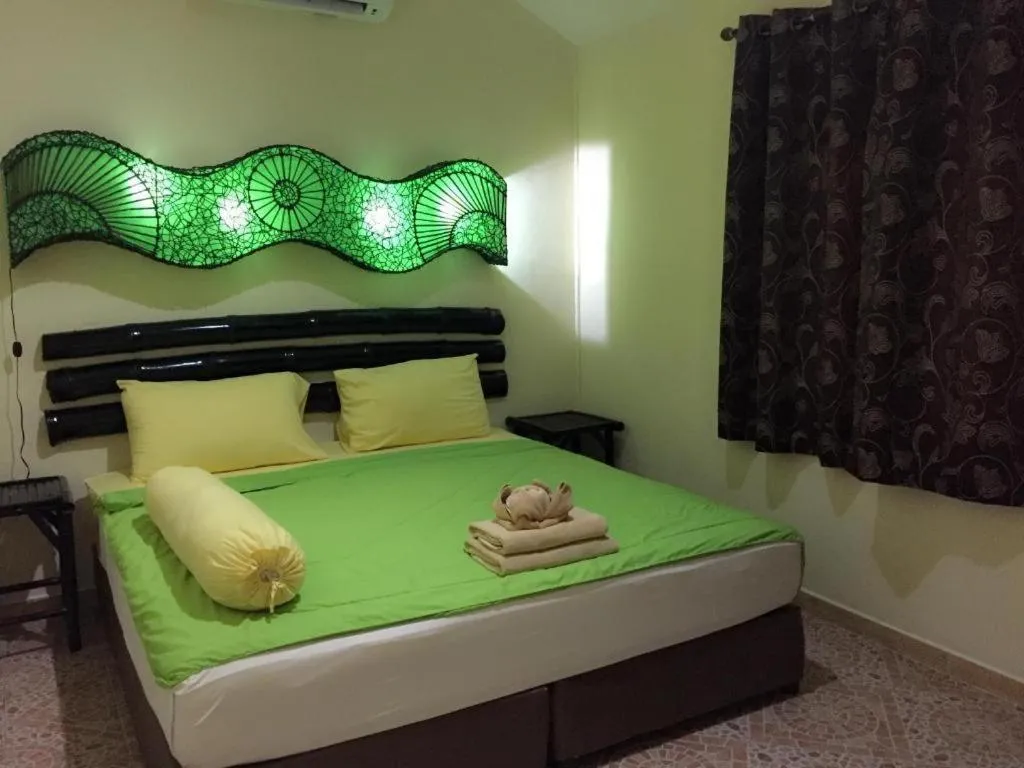 Bed in Kamala Tropical Garden Hotel