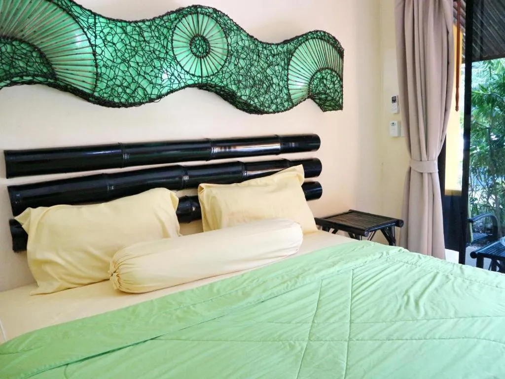 Bed in Kamala Tropical Garden Hotel