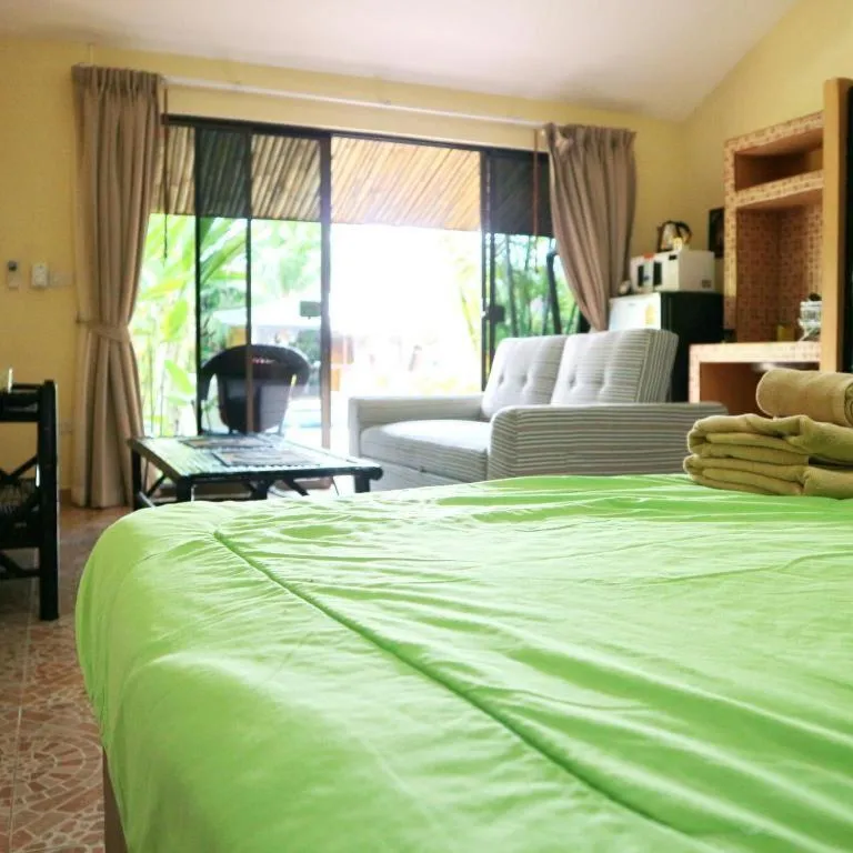 Bed in Kamala Tropical Garden Hotel