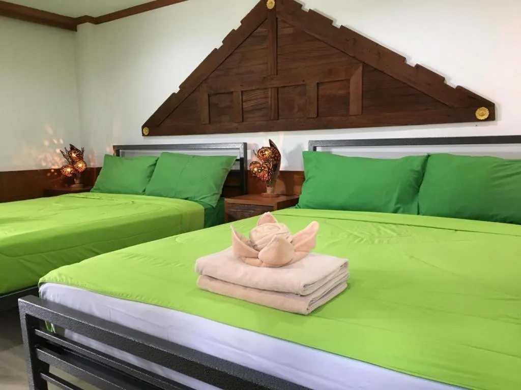 Bed in Kamala Tropical Garden Hotel