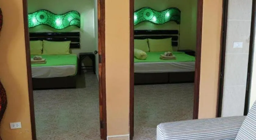 Bed in Kamala Tropical Garden Hotel