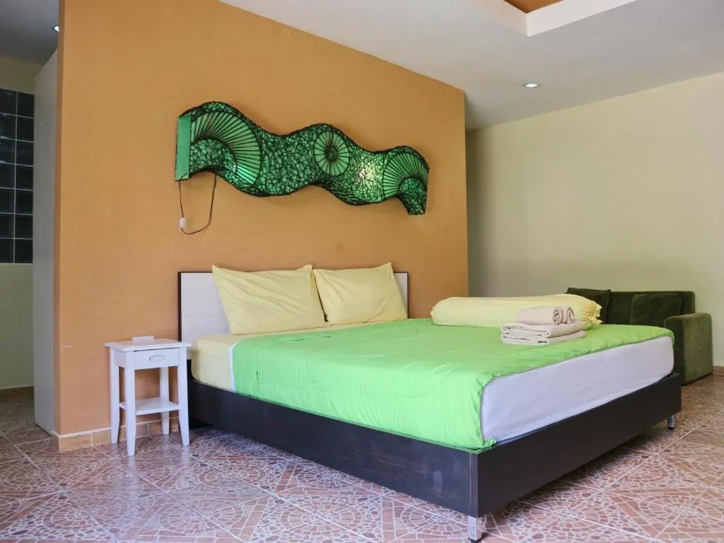 Bed in Kamala Tropical Garden Hotel