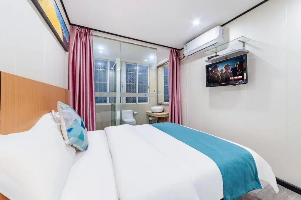 Bed in Xinghe Xinfeng Hotel Railway Station & Bus Station Branch