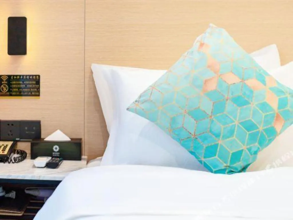 Bed in Xinghe Xinfeng Hotel Railway Station & Bus Station Branch