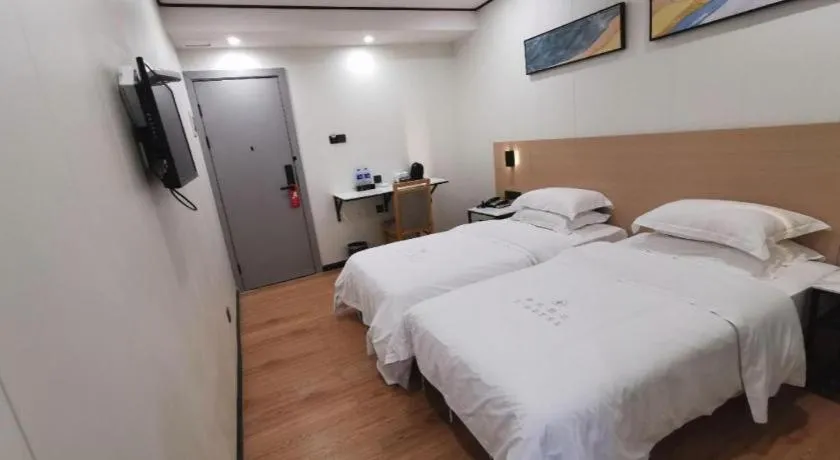 Bed in Xinghe Xinfeng Hotel Railway Station & Bus Station Branch