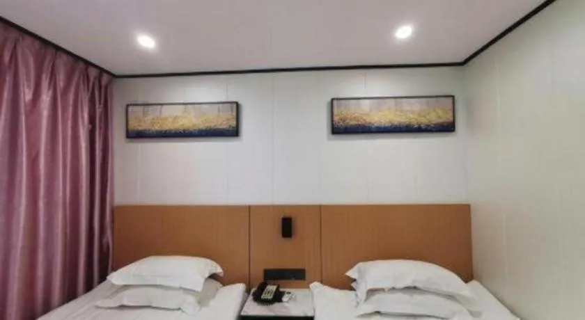 Bed in Xinghe Xinfeng Hotel Railway Station & Bus Station Branch