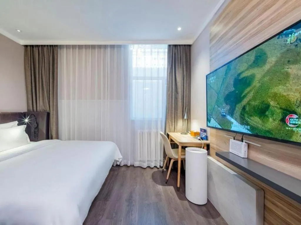 Bed in Hanting Premium Hotel Beijing Wudaokou East Gate of Tsinghua