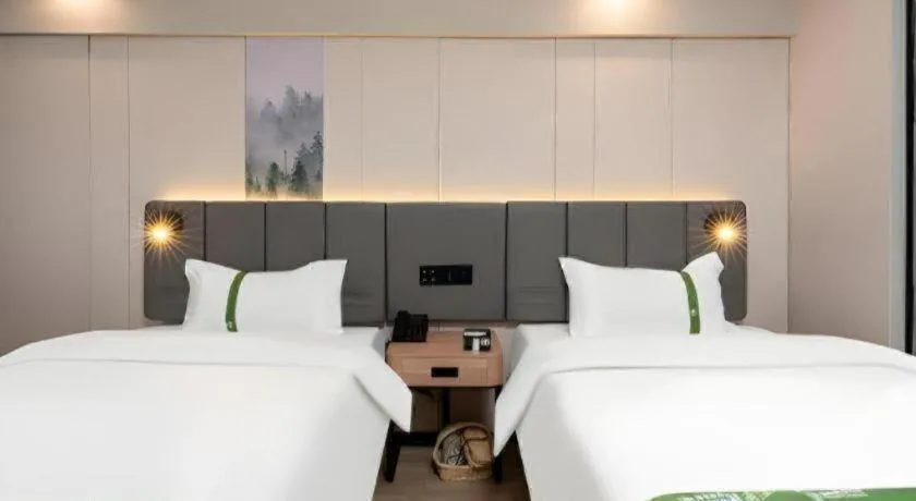 Bed in GreenTree Inn Jinan Quancheng Hotel