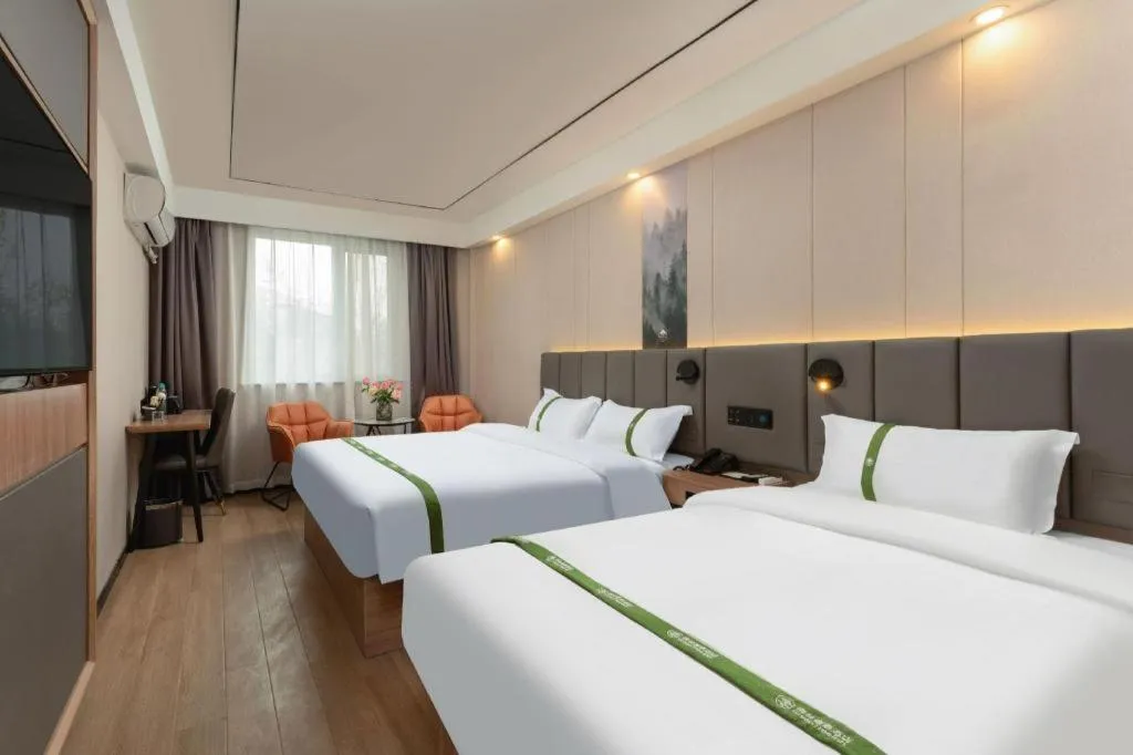 Bed in GreenTree Inn Jinan Quancheng Hotel