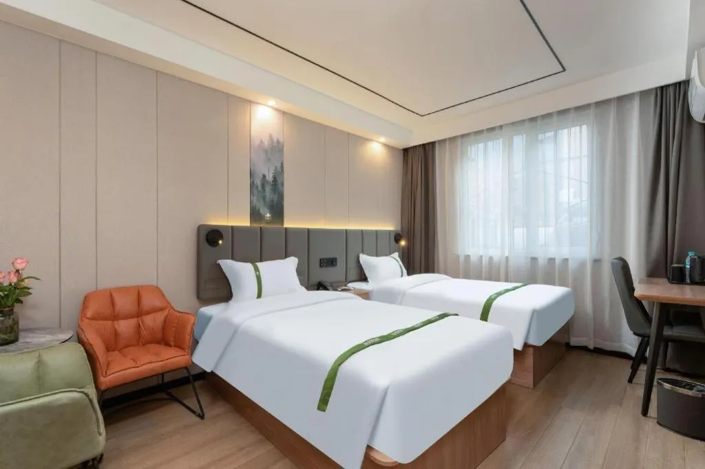 Bed in GreenTree Inn Jinan Quancheng Hotel