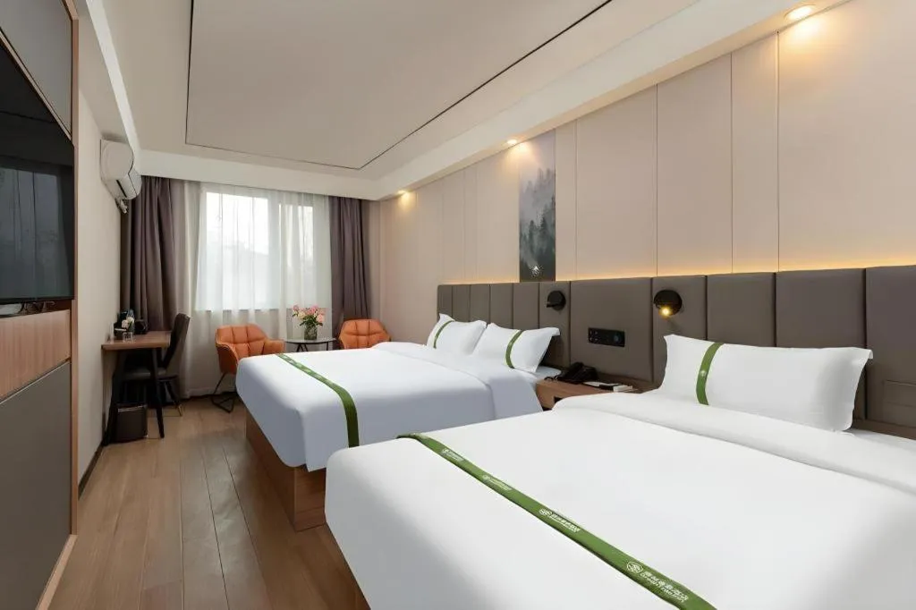 Bed in GreenTree Inn Jinan Quancheng Hotel