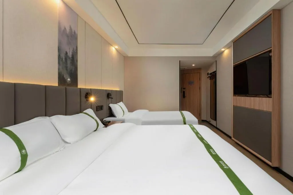 Bed in GreenTree Inn Jinan Quancheng Hotel