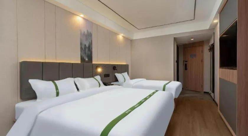 Bed in GreenTree Inn Jinan Quancheng Hotel