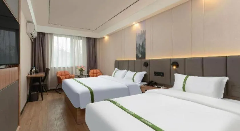 Bed in GreenTree Inn Jinan Quancheng Hotel