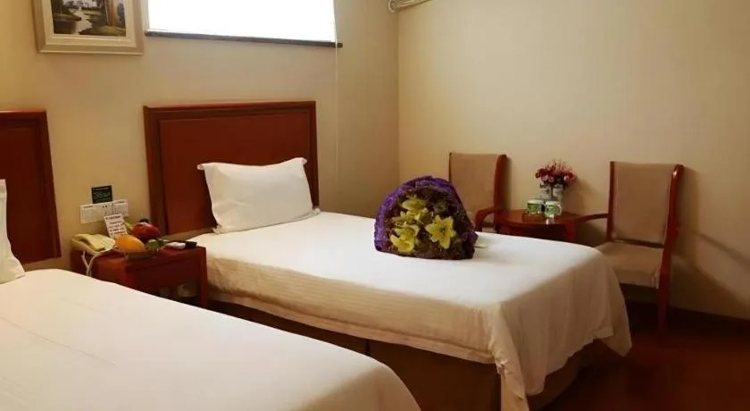 Bed in GreenTree Inn Jinan Quancheng Hotel