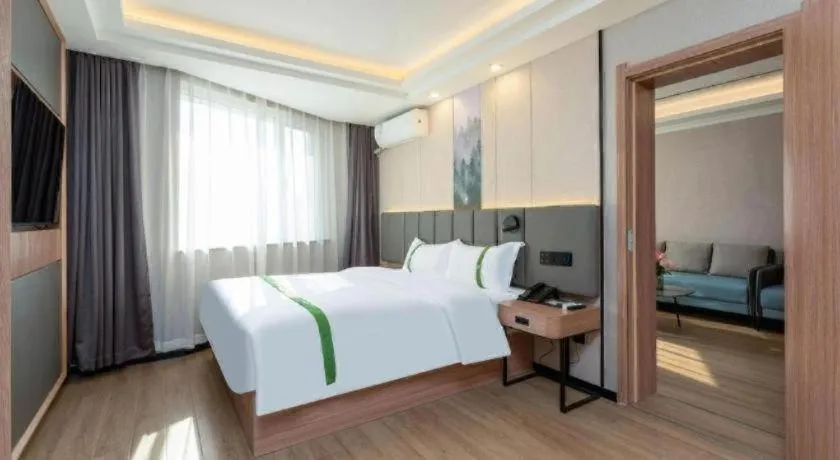 Bed in GreenTree Inn Jinan Quancheng Hotel