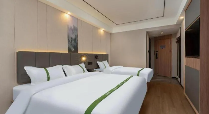 Bed in GreenTree Inn Jinan Quancheng Hotel