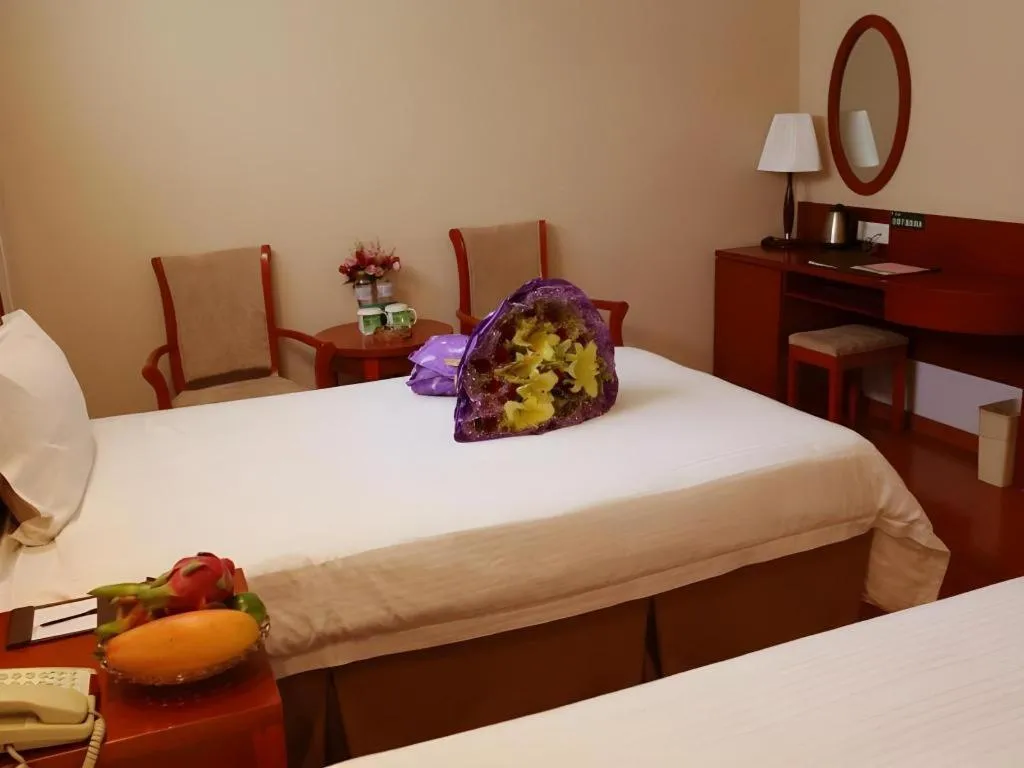 Bed in GreenTree Inn Jinan Quancheng Hotel