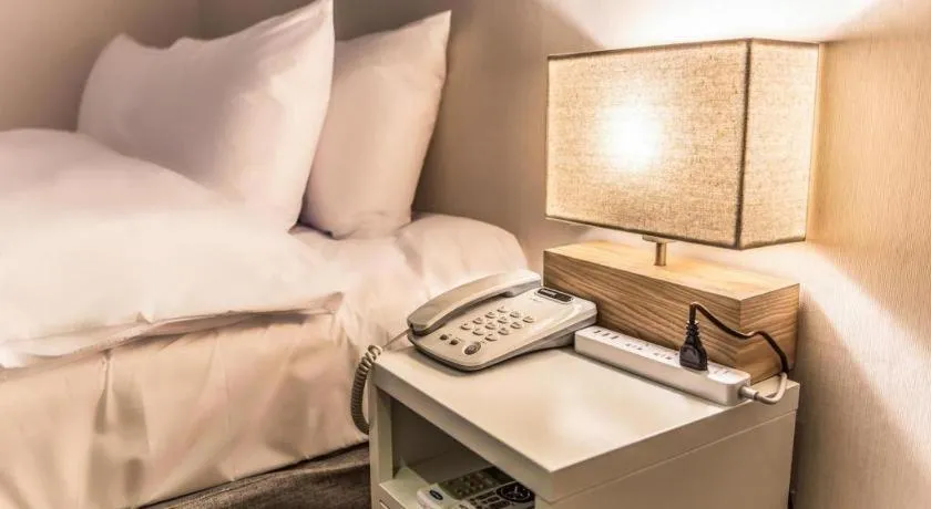 Bed in Check Inn Hotel