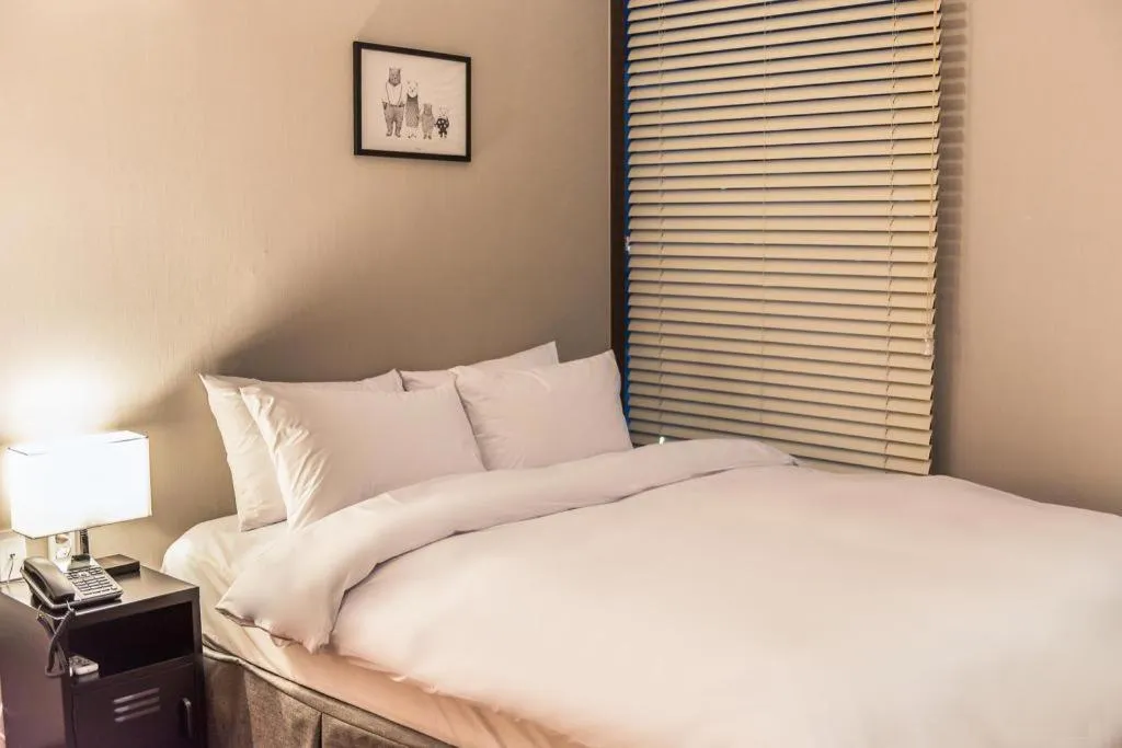 Bed in Check Inn Hotel