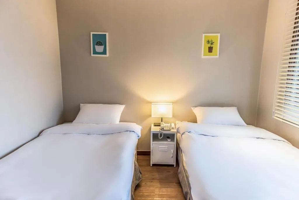 Bed in Check Inn Hotel