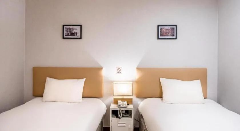 Bed in Check Inn Hotel