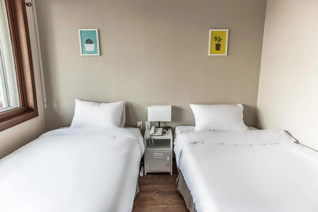 Bed in Check Inn Hotel