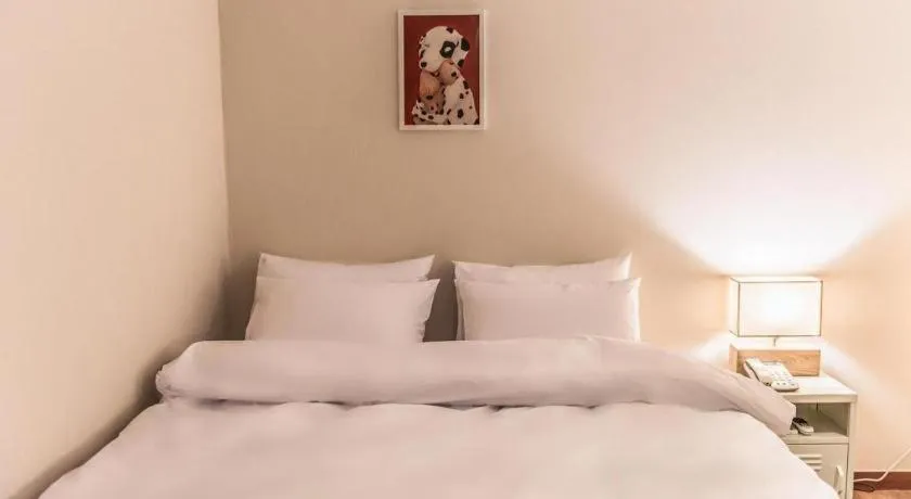 Bed in Check Inn Hotel