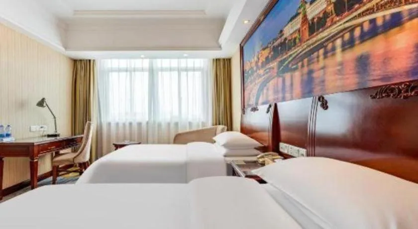 Bed in Vienna International Hotel Guangzhou Tianhe Olympic Stadium Dongpu