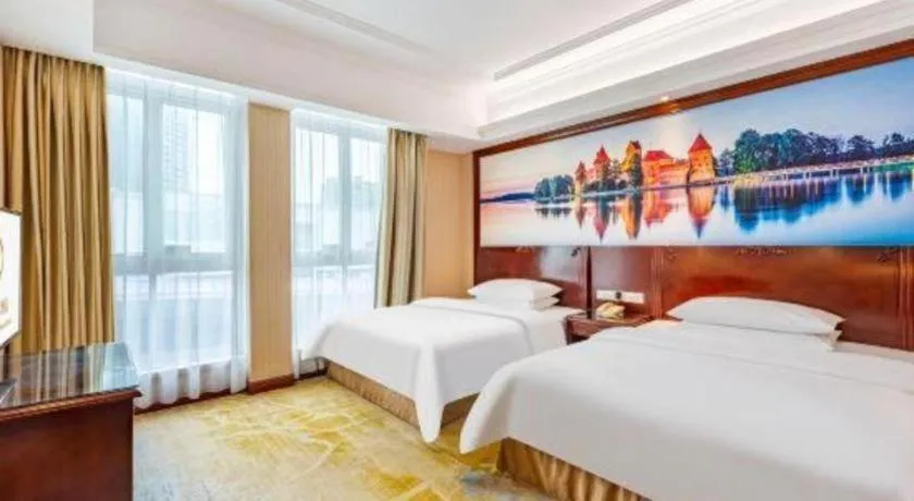 Bed in Vienna International Hotel Guangzhou Tianhe Olympic Stadium Dongpu