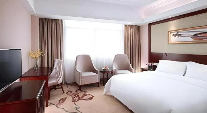 Bed in Vienna International Hotel Guangzhou Tianhe Olympic Stadium Dongpu