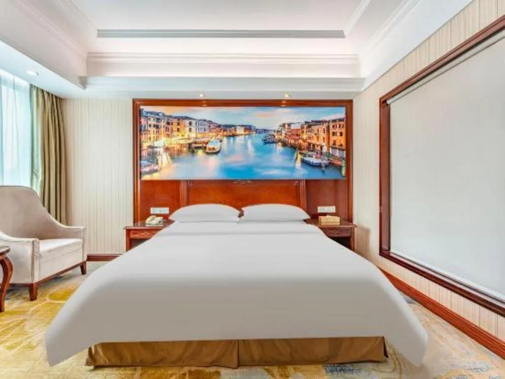 Bed in Vienna International Hotel Guangzhou Tianhe Olympic Stadium Dongpu