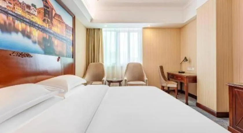 Bed in Vienna International Hotel Guangzhou Tianhe Olympic Stadium Dongpu
