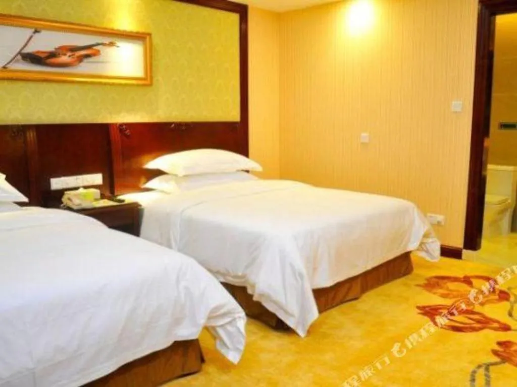Bed in Vienna International Hotel Guangzhou Tianhe Olympic Stadium Dongpu