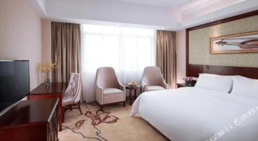 Bed in Vienna International Hotel Guangzhou Tianhe Olympic Stadium Dongpu
