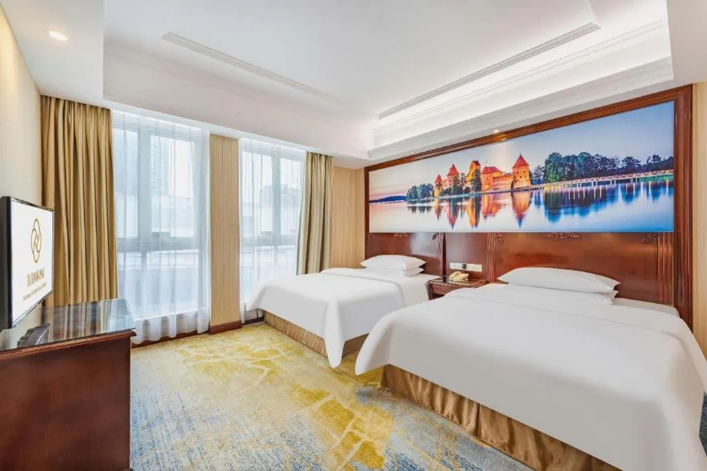 Bed in Vienna International Hotel Guangzhou Tianhe Olympic Stadium Dongpu