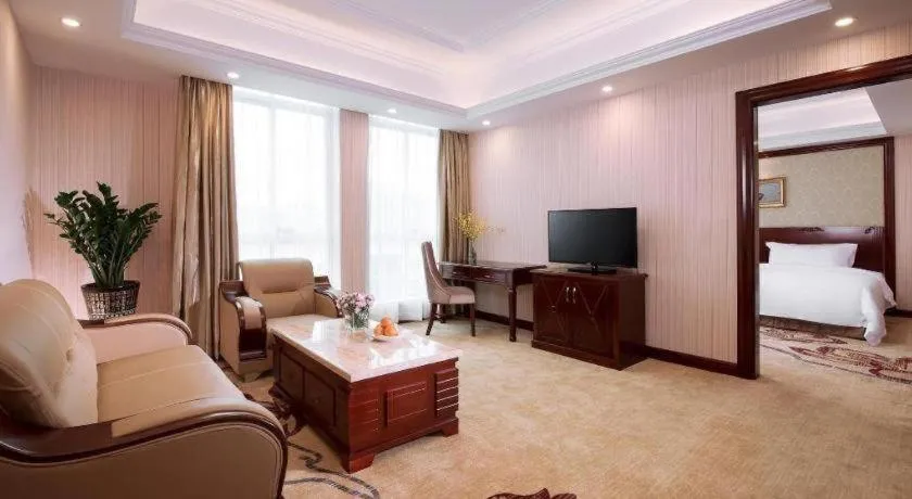 Bed in Vienna International Hotel Guangzhou Tianhe Olympic Stadium Dongpu