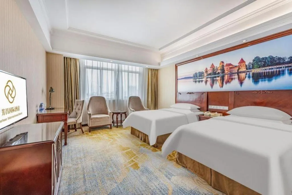 Bed in Vienna International Hotel Guangzhou Tianhe Olympic Stadium Dongpu