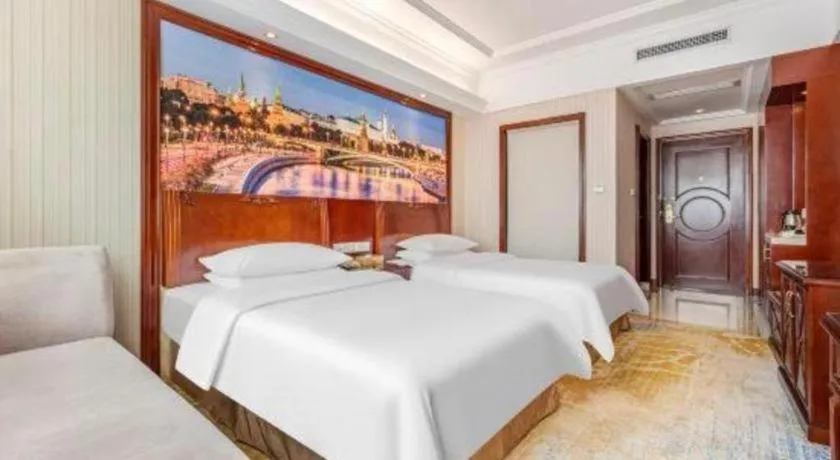 Bed in Vienna International Hotel Guangzhou Tianhe Olympic Stadium Dongpu