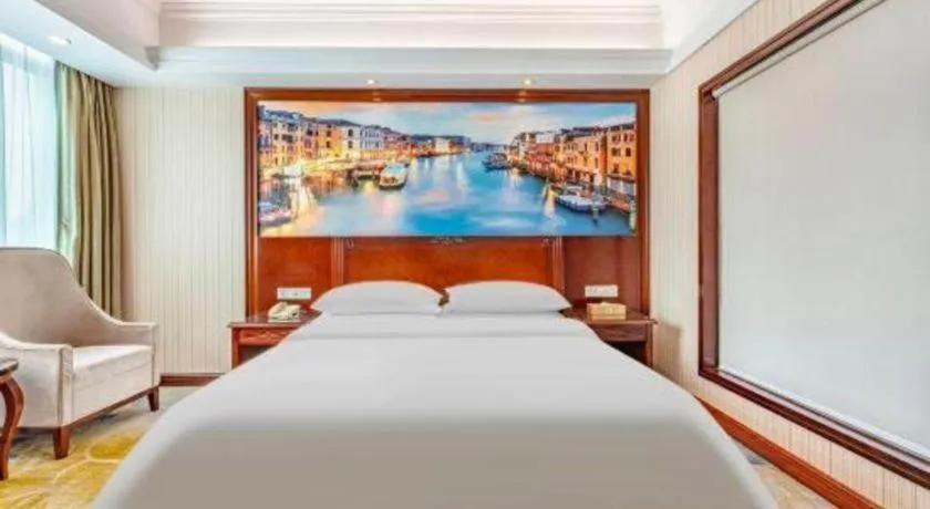 Bed in Vienna International Hotel Guangzhou Tianhe Olympic Stadium Dongpu
