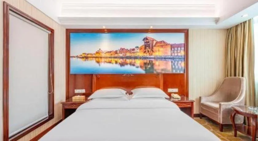 Bed in Vienna International Hotel Guangzhou Tianhe Olympic Stadium Dongpu