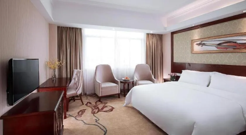 Bed in Vienna International Hotel Guangzhou Tianhe Olympic Stadium Dongpu