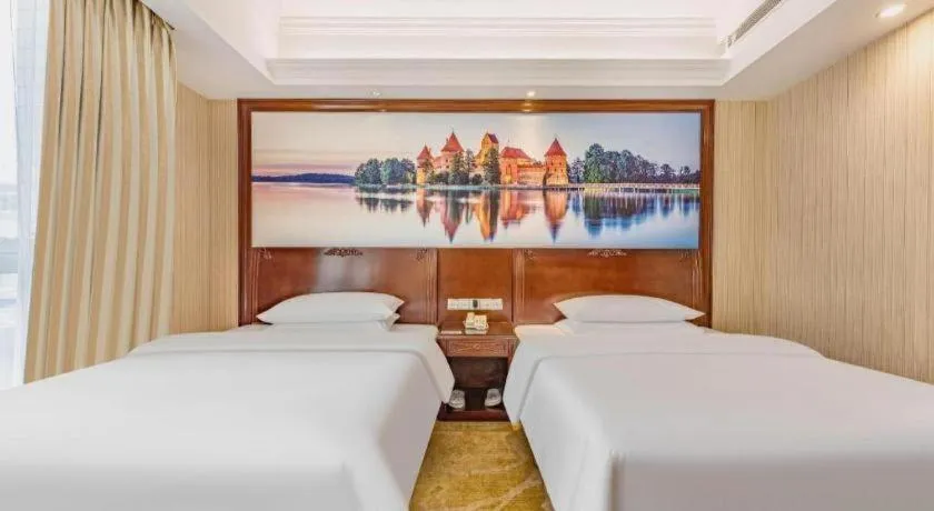 Bed in Vienna International Hotel Guangzhou Tianhe Olympic Stadium Dongpu