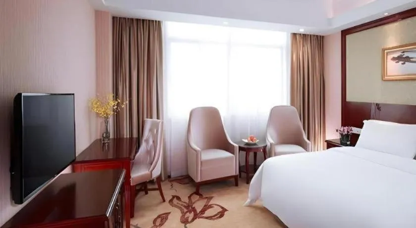 Bed in Vienna International Hotel Guangzhou Tianhe Olympic Stadium Dongpu