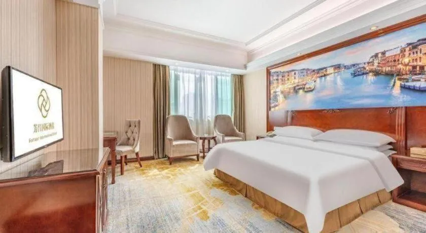 Bed in Vienna International Hotel Guangzhou Tianhe Olympic Stadium Dongpu